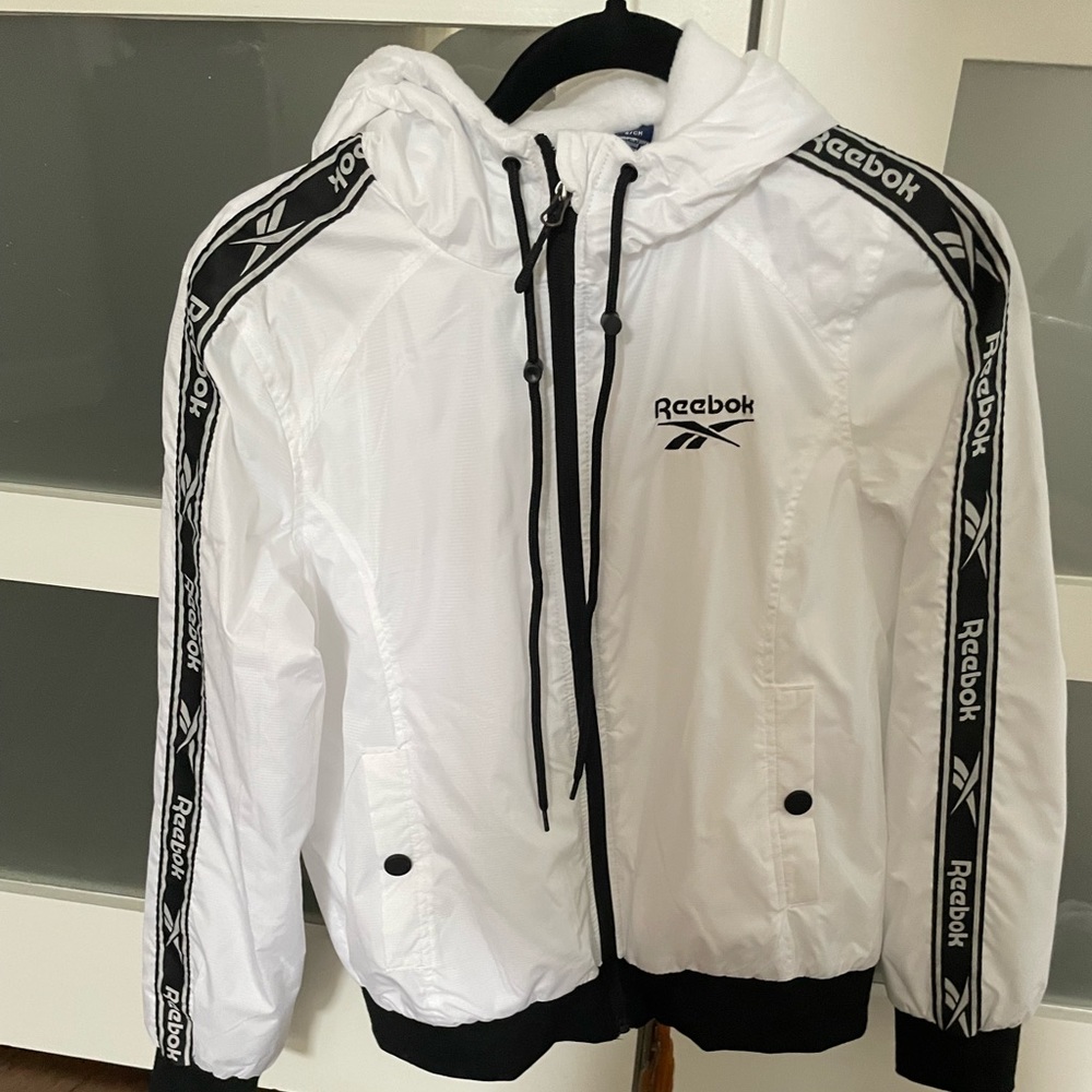 Women’s Reebok white nylon jacket. Size Small.